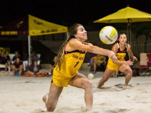 Junior setter Bianca Arellano digs a ball during the ASU vs Nebraska sand volleyball game at the Tempe PERA Club on March 25, 2015. 