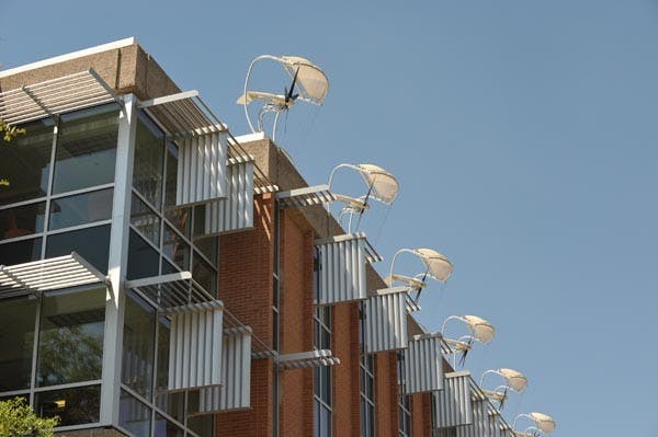 WHERES THE WIND: The wind turbines on top of ASU's Global Institute of Sustainability stand Sunday with the lack of wind passing through them. (Photo by Chris Stark)