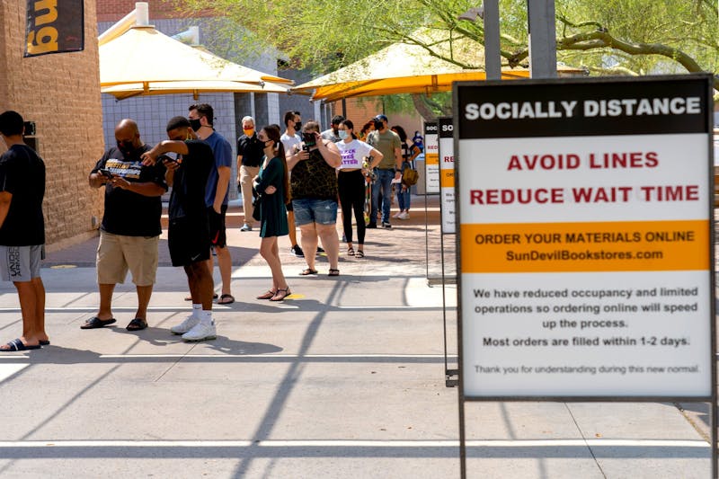 Students practice social distancing while waiting in line at the ASU Tempe Bookstore on Thursday, Aug. 20, 2020.