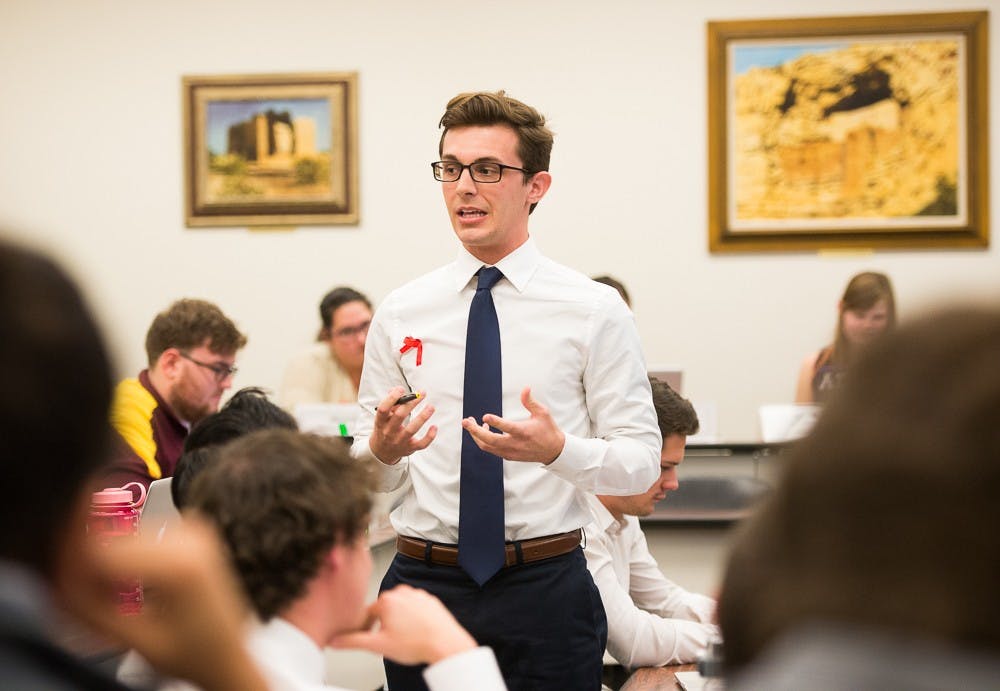 College of Liberal Arts and Sciences Senator and Government Operations Chair Kanin Pruter gives updates about election code at the Tempe Undergraduate Student Government on Tuesday, Dec. 1, 2015, on the Tempe campus.