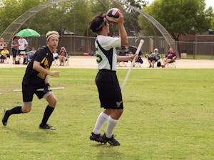 Daniel Martin (left), of Sun Devil Quidditch, and Corban Stevens of NAU Narwhals Quidditch compete during a tournament at Jaycee Park on Saturday, Oct. 17, 2015 in Tempe.
