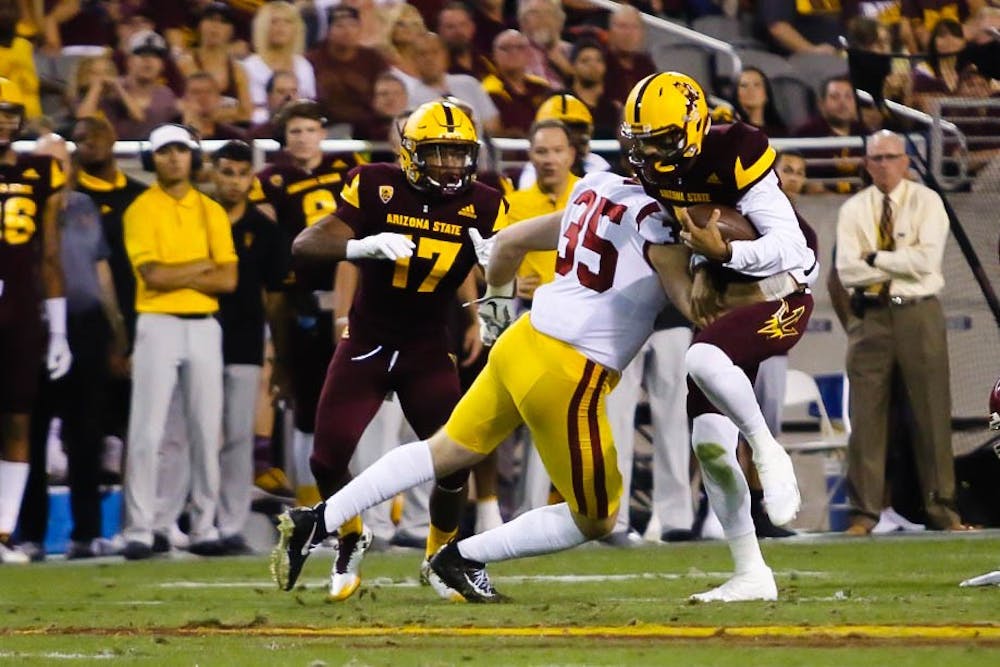 Manny Wilkins Takes a Hit from Cameron Smith