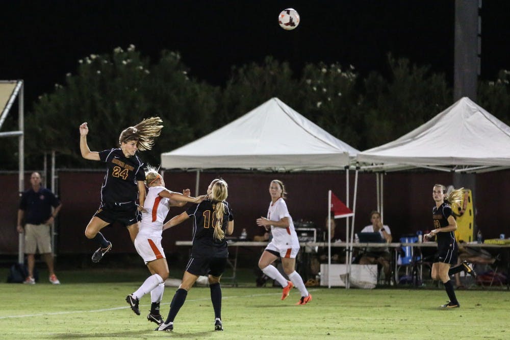 4. Senior Kaitlyn Pavlovich jumps in anticipation of heading the ball. ASU won the game 4-3. (Arianna Grainey)