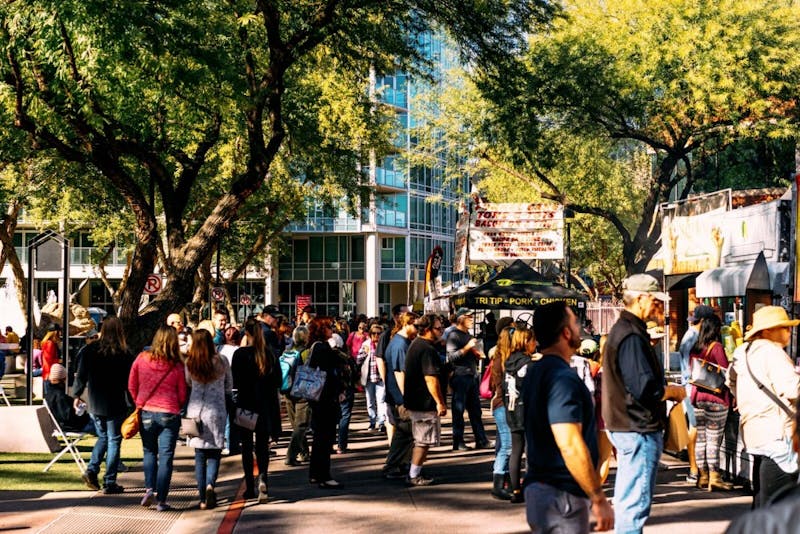 Visitors pictured at the spring 2017 Tempe Festival of the Arts in Tempe, Arizona.