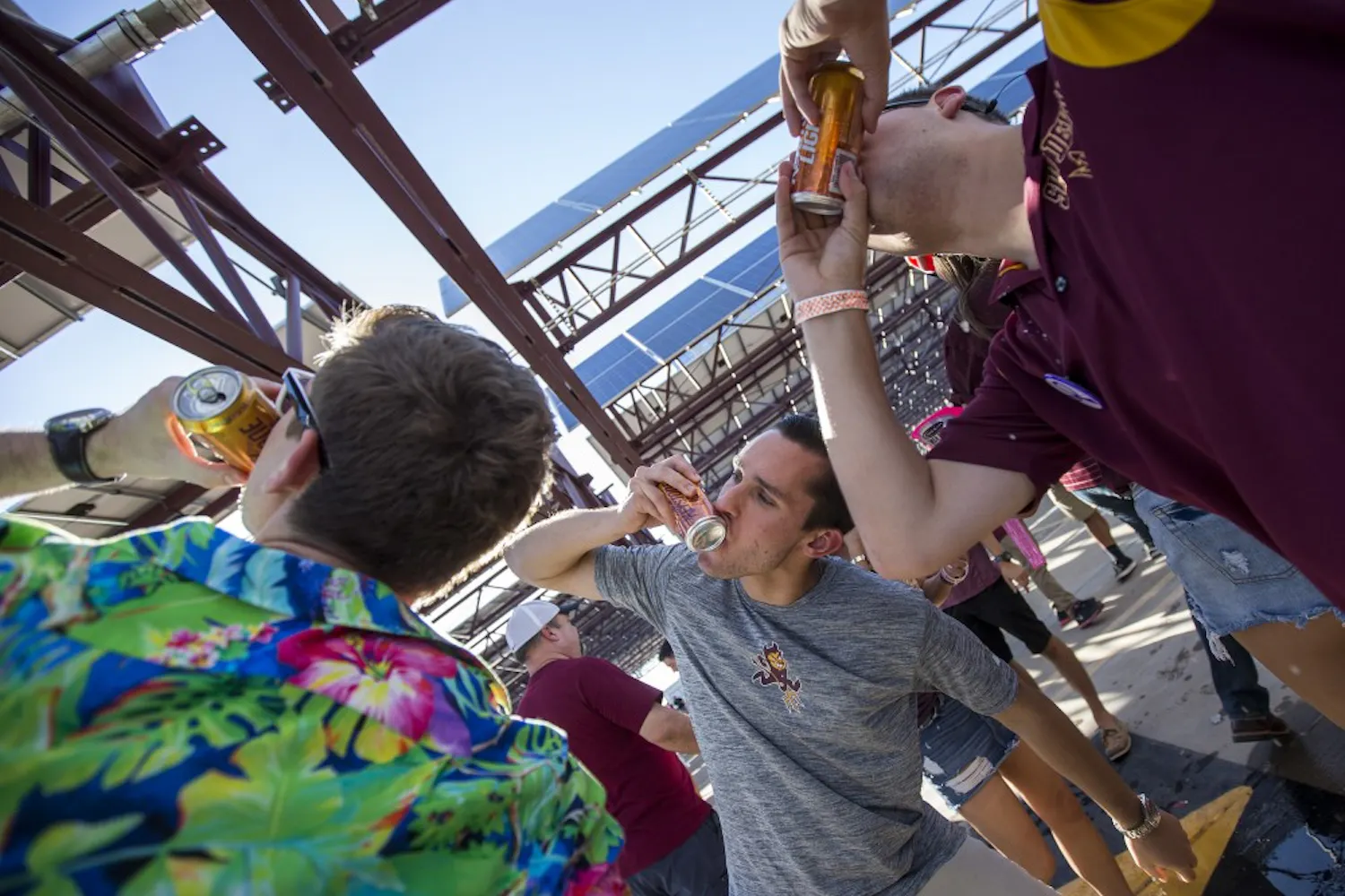 Fans tailgate in a parking garage across from Sun Devil Stadium before an ASU football game against the California Golden Bears on Saturday, Sept. 24, 2016.