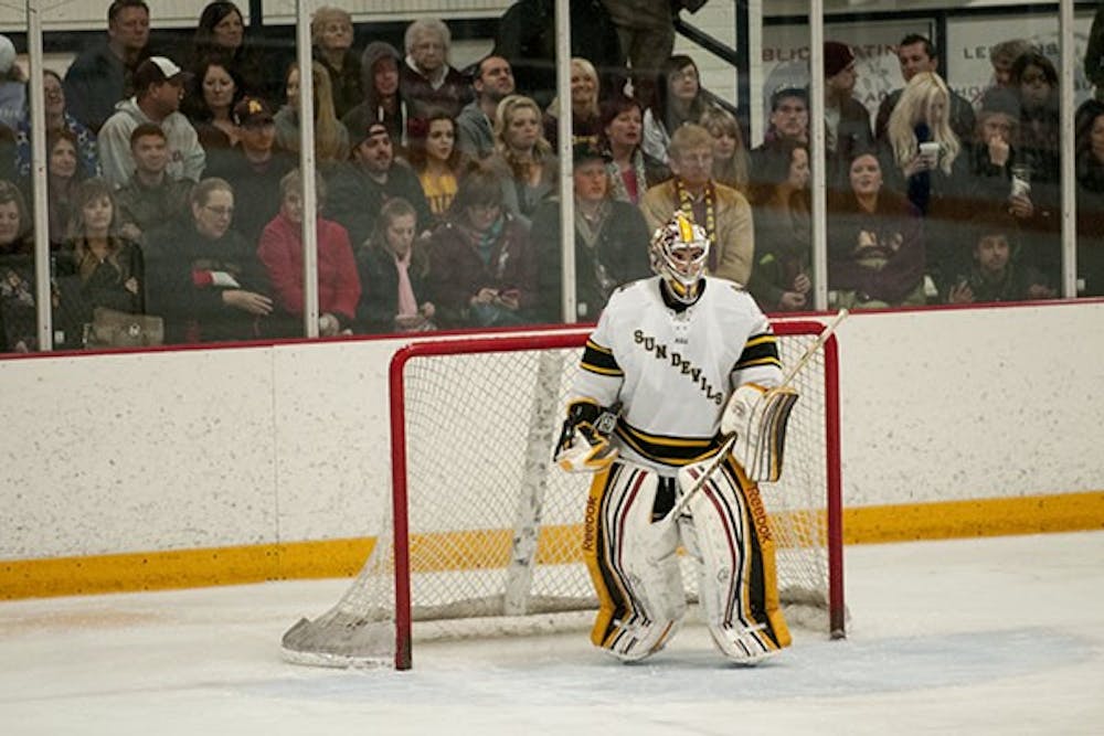 Senior goalie Joe D'Elia stands in front of the goal during a game at home in Tempe. 