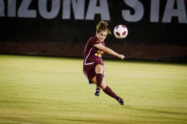 FIRE AWAY: Freshman midfielder Holland Crook kicks a pass downfield against USC. Crook is part of a young core on the ASU women's soccer team that coach Kevin Boyd believes can only get better after two straight NCAA Tournament appearances. (Photo by Aaron Lavinsky)