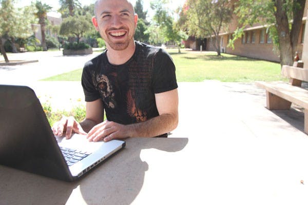 GEEKING IT UP: Self proclaimed "Geek Jock" Chris Price works off his computer to produce a podcast about his life as both a computer geek and college jock. (Photo by Nikolai de Vera)