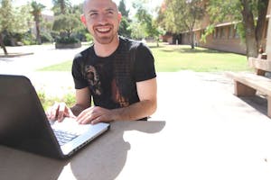 GEEKING IT UP: Self proclaimed "Geek Jock" Chris Price works off his computer to produce a podcast about his life as both a computer geek and college jock. (Photo by Nikolai de Vera)