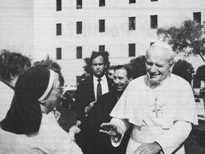 In this State Press file photo, Pope John Paul II greets a well-wisher at St. Joseph’s hospital in Phoenix on Monday, Sept. 14, 1987. (Courtesy of The Arizona Republic)