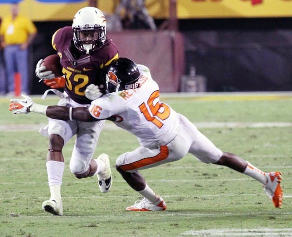 HONOR-WORTHY: ASU junior wide receiver Jamal Miles tries to break a tackle by Oregon State sophomore corner back Rashaad Reynolds during the Sun Devils’ victory on Saturday. Miles was named Pac-12 Player of the Week for his performance against the Beavers. (Photo by Lisa Bartoli)