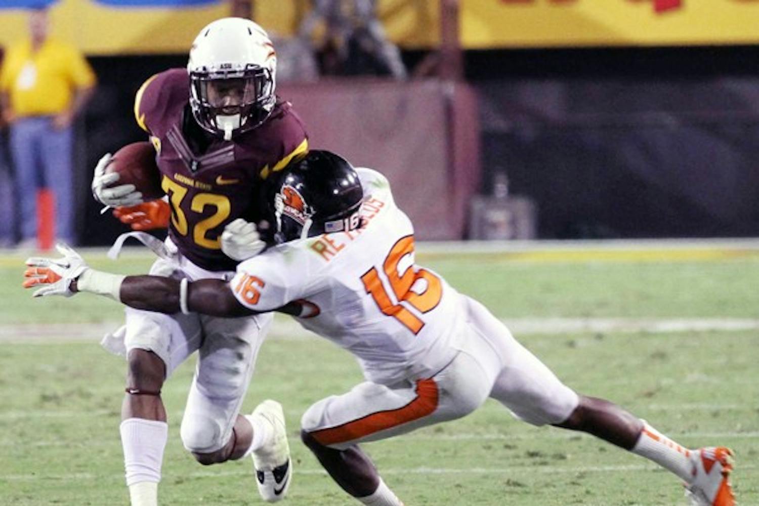 HONOR-WORTHY: ASU junior wide receiver Jamal Miles tries to break a tackle by Oregon State sophomore corner back Rashaad Reynolds during the Sun Devils’ victory on Saturday. Miles was named Pac-12 Player of the Week for his performance against the Beavers. (Photo by Lisa Bartoli)