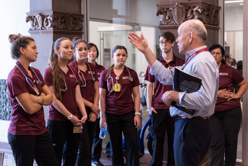 Michael Shafer, PhD., the founding director of the ASU Center for Applied Behavioral Health Policy, gives a tour of the new facility, located in the Westward Ho building, to the students of NUR 420, the Community Health Nursing Clinical, on Thursday, Aug. 25, 2016.