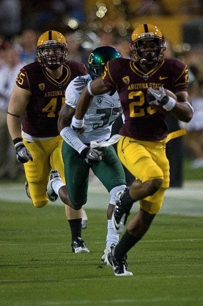 FULL SPEED: Freshman running back Deantre Lewis sprints away from an Oregon defender during the Ducks’ 42-31 victory Saturday night. Lewis gained 127 yards on 11 carries, including a 53-yard touchdown run. (Photo by Aaron Lavinsky)
