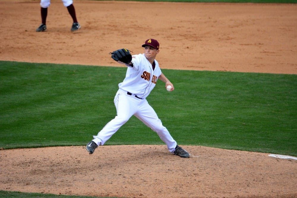 Freshman lefthanded pitcher Ryan Kellogg winds up for a throw in a match against USC on April 5, 2014. (Photo by Mario Mendez)