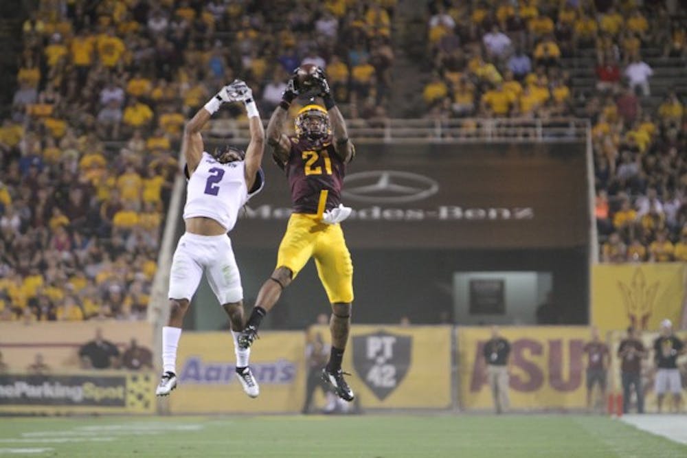 Redshirt junior wide receiver Jaelen Strong makes a leaping catch over Weber State cornerback Cordero Dixon. ASU leads 31-0 at halftime. (Photo by Sean Logan)