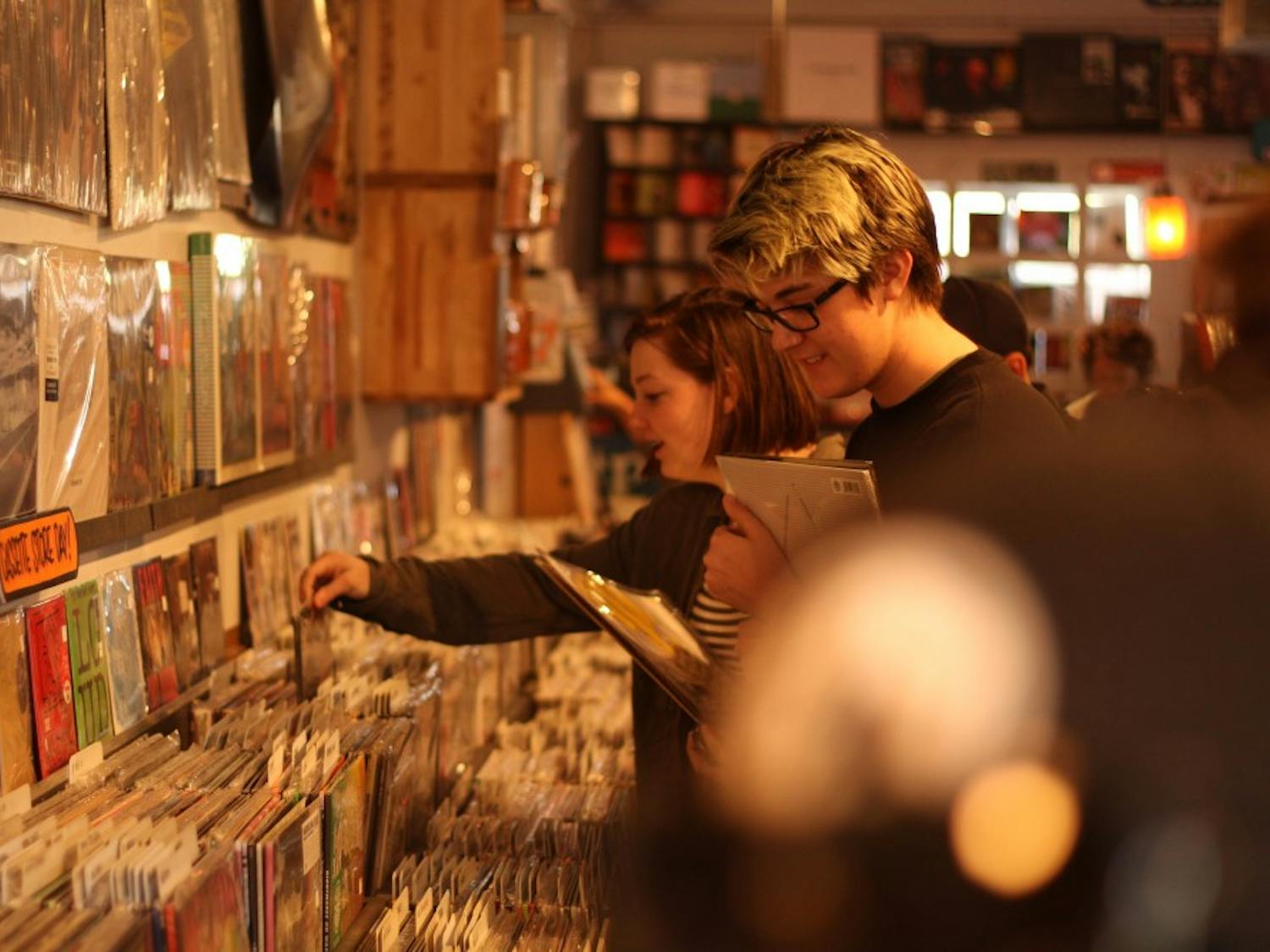 People shop for records on Black Friday Record Store day at Stinkweeds Records on 12 W. Camelback Rd in Phoenix. (Photo by Zane Jennings)