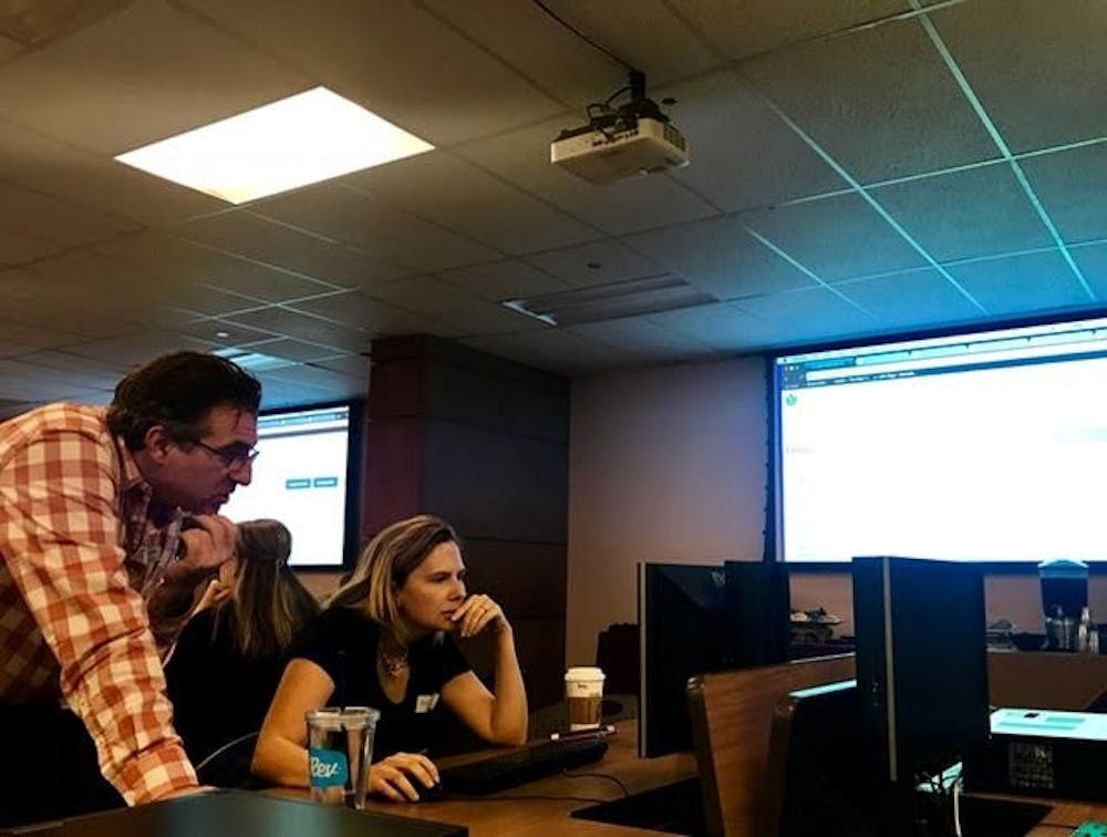Mimmo Bonanni helps an editor during the Wikipedia edit-a-thon at Hayden Library on ASU's Tempe campus on Friday, March 31, 2017.