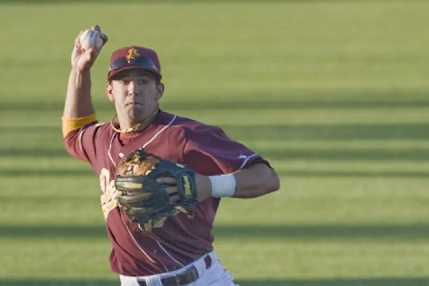 Stacked: ASU sophomore Deven Marrero makes a throw in the infield during a game last season. Despite losing several players to the majors during the offseason, the Sun Devils still have a loaded squad. (Photo by Scott Stuk)