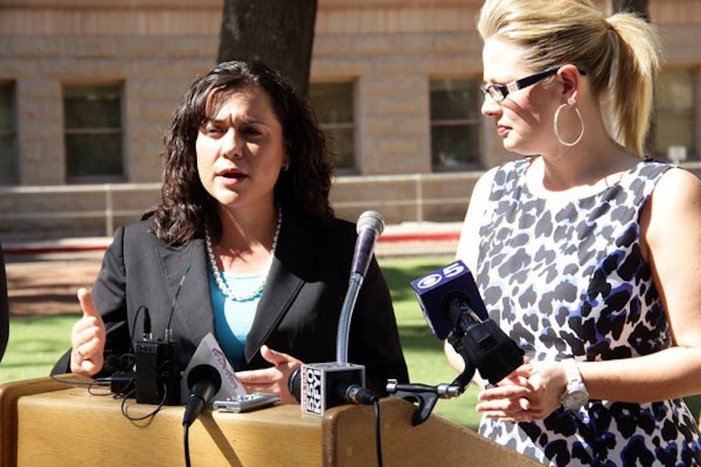 Arizona House Minotiry Whip Anna Tovar, D-Tolleson and Kyrsten Sinema, Democratic candidate for U.S. Representative from Arizona's 9th Congressional District addressed the media outside of the Arizona Capitol building Thursday morning after the Supreme Court's decision to uphold the President Barack Obama's controversial health care law by a 5-4 vote. (Photo by Shawn Raymundo)