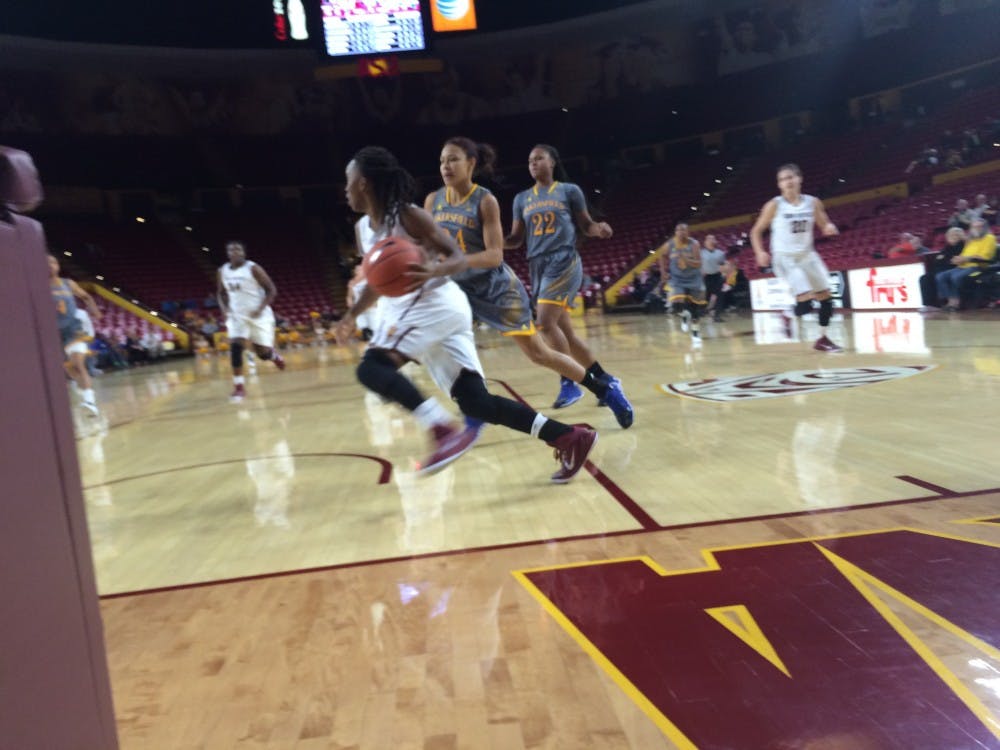 Junior guard Peace Amukamara dribbles the ball along the baseline during ASU's 83-54 win over CSU Bakersfield  at Wells Fargo Arena on Wednesday, Nov. 19 2014. (Photo by Stefan Modrich)