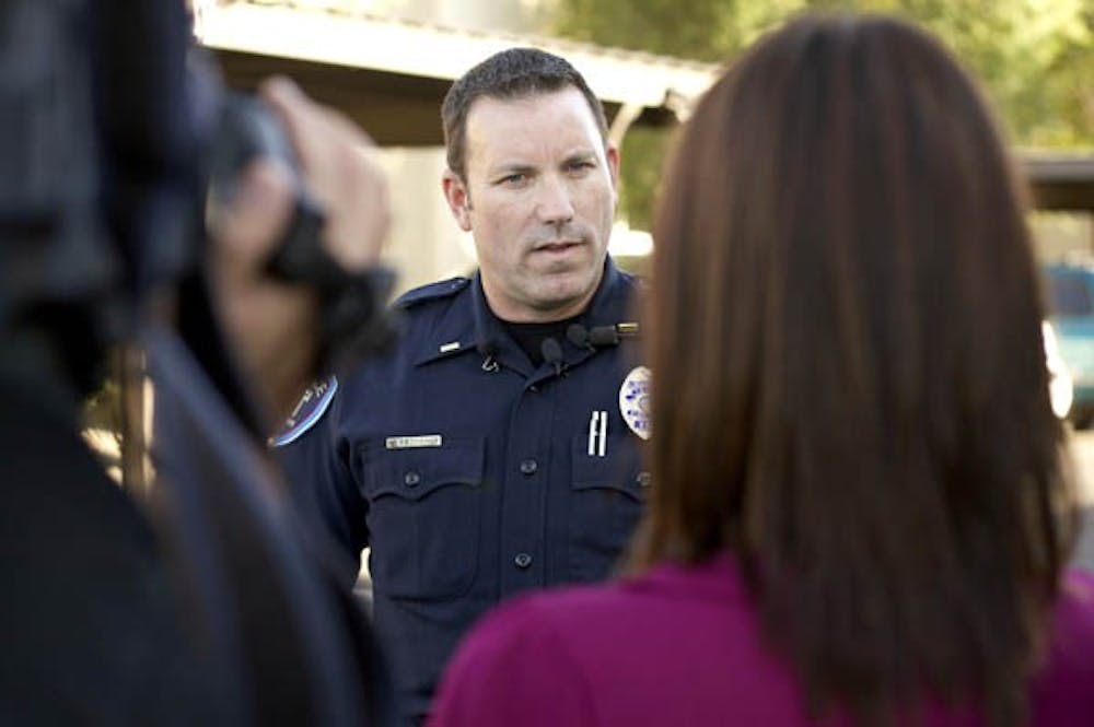 POLICE CRACKDOWN: Lieutenant Vince Boerbon of the Tempe Police Department talks to reporters Monday afternoon at Tempe Villas Apartments on University Drive following the murder of an ASU student there Sunday night. (Photo by Scott Stuk)