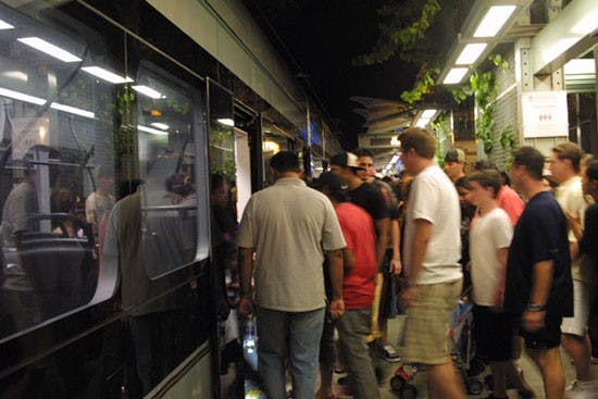 ALL ABOARD: Hundreds of passengers board the lightrail after the Independence Day celebration at Tempe Beach Park Sunday night.(Photo by Serwaa Adu-Tutu)