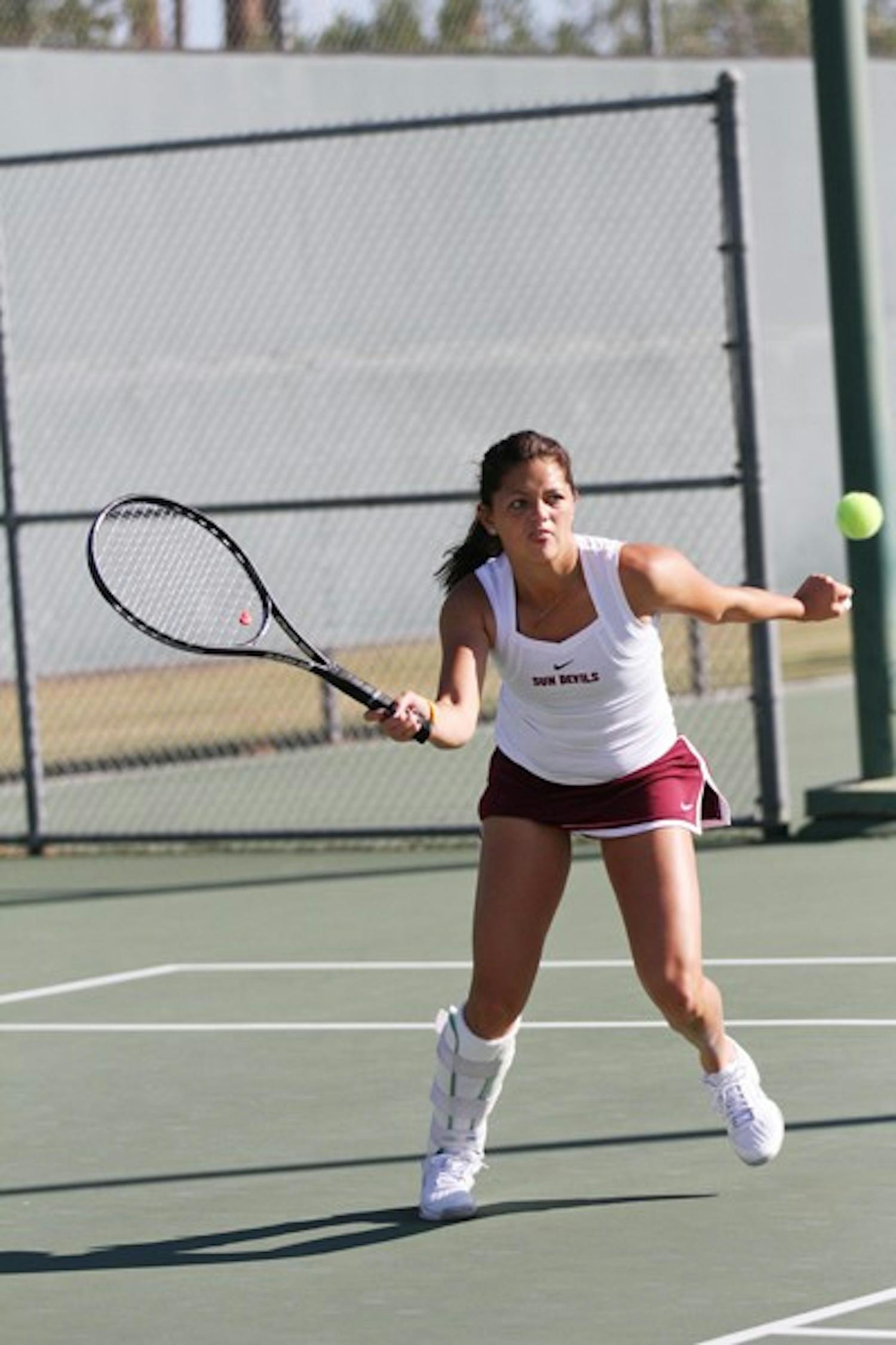 Leighann Sahagun volleys at the National Individual Indoors tournament. Sahagun’s status for this weekend’s matches is in question due to a wrist injury. (Photo by Lisa Bartoli)