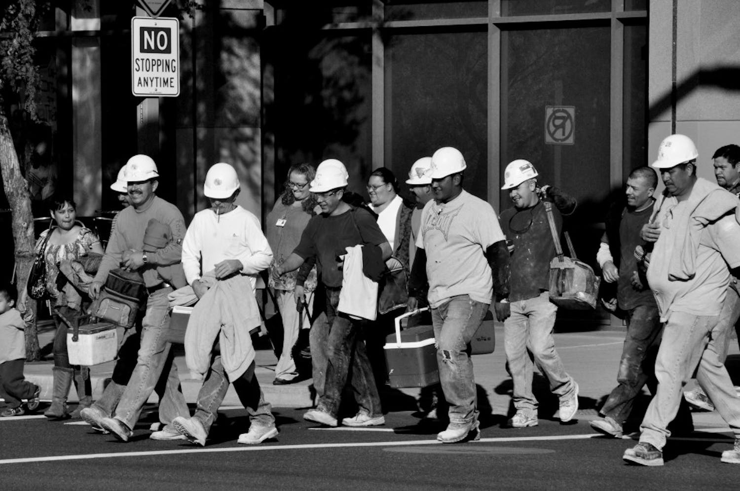 LUNCH BREAK: Construction workers head back to duty after lunch. There are a variety of construction projects around the Downtown campus including Central Park East, a new office building that will be erected by University Center. (Photo by Sierra Smith)