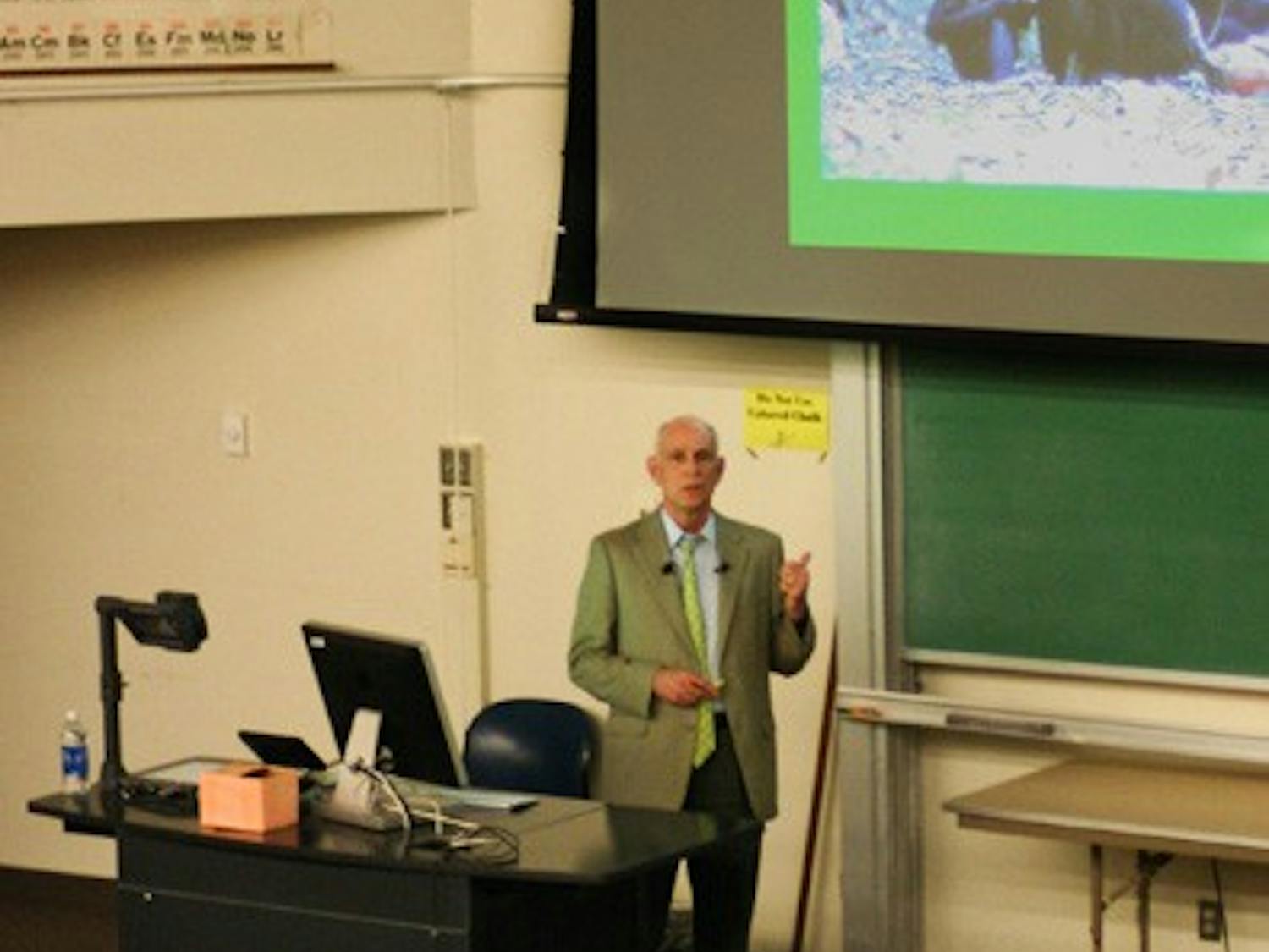 ORIGINS OF MAN: As part of the Institute of Human Origins lecture series, William McGrew addresses an audience on the Tempe campus Thursday evening about his research experience with chimpanzees. (Photo by Lisa Bartoli) 