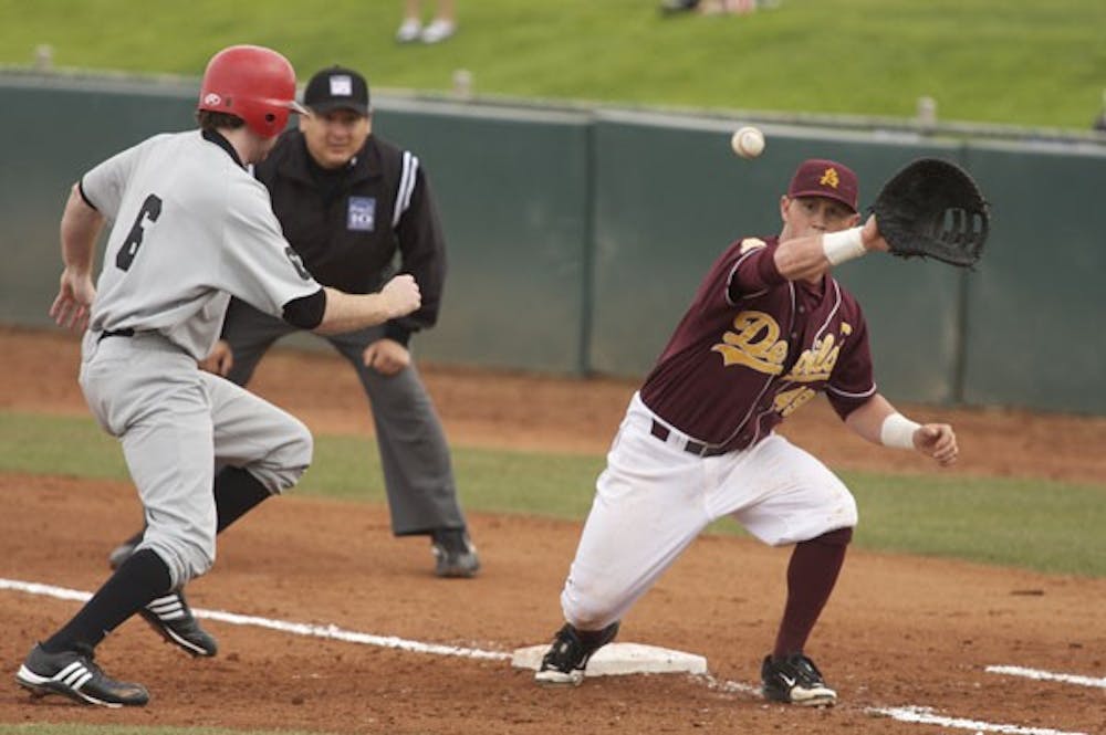 NOT IN TIME: ASU senior first baseman Kole Calhoun stretches to catch a pickoff attempt during a game earlier this year at Packard Stadium. The Sun Devils will open up the Coca-Cola Classic against Cal Poly on Thursday in Surprise. (Photo by Scott Stuk)