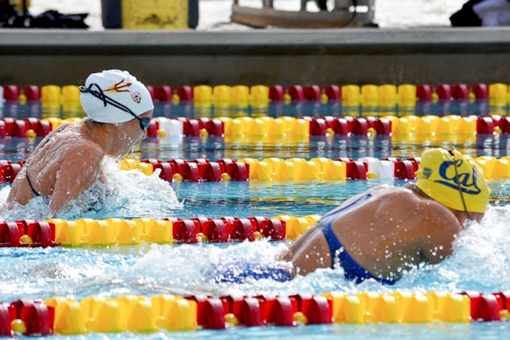 Freshman Jorie Caneta (left) keeps pace with Cal sophomore Celina Li in the 200-meter breaststroke, Saturday, Jan. 23, 2015, at Mona Plummer Aquatic Complex in Tempe.  ASU senior Tory Houston (not pictured) won with a time of 2:16:81; Caneta finished second with a time of 2:17:52. (Krista Tillman/The State Press)