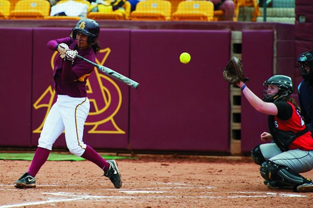 HOLDING UP: ASU sophomore Christina Zambrana checks her swing during the Sun Devils’ win against Rutgers in February. ASU was swept by California this past weekend at Farrington Stadium. (Photo by Michael Arellano)