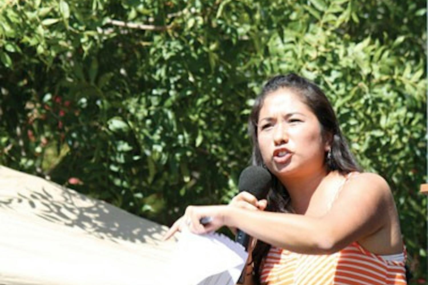 'When I drove to ASU, I had to worry I would be deported,' Dulce Matuz, an ASU graduate named one of TIME's most influential people of 2012, said on Hayden Lawn when she spoke about the recent DREAM Act Wednesday afternoon.  (Photo by Cameron Tattle)