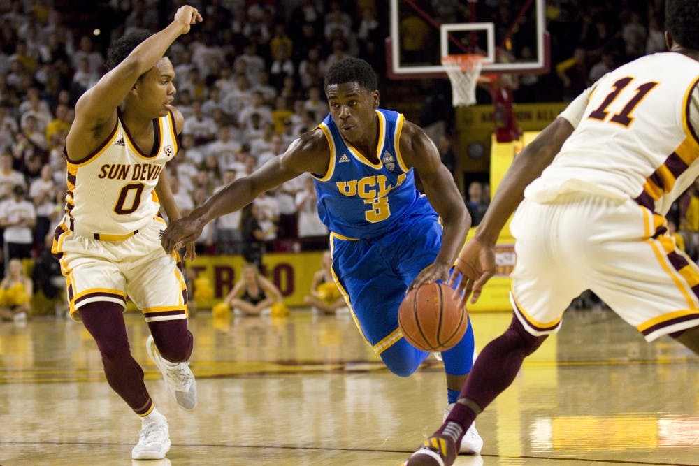 UCLA sophomore guard Aaron Holiday (3) drives towards the basket with ASU junior guard Tra Holder (0) guarding during a men's basketball game versus the Arizona State Sun Devils in Wells Fargo Arena in Tempe, Arizona on Thursday, Feb. 23, 2017. ASU lost the game 87-75. (Josh Orcutt/State Press) 