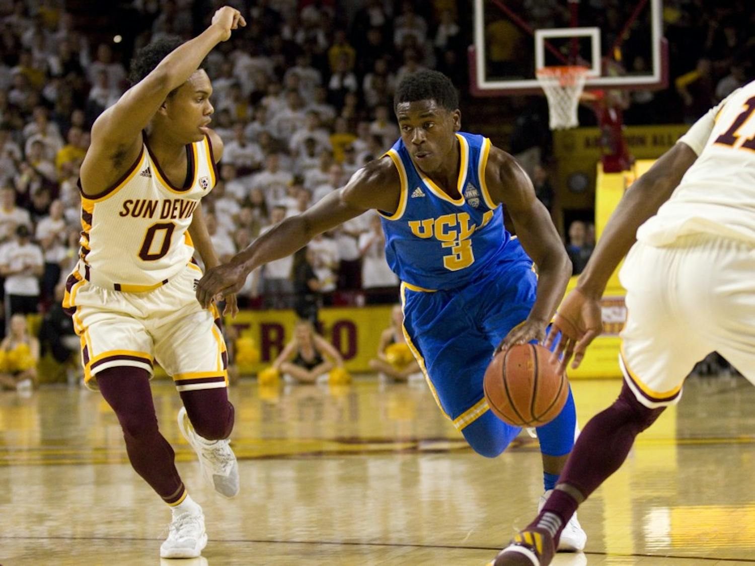 UCLA sophomore guard Aaron Holiday (3) drives towards the basket with ASU junior guard Tra Holder (0) guarding during a men's basketball game versus the Arizona State Sun Devils in Wells Fargo Arena in Tempe, Arizona on Thursday, Feb. 23, 2017. ASU lost the game 87-75. (Josh Orcutt/State Press) 