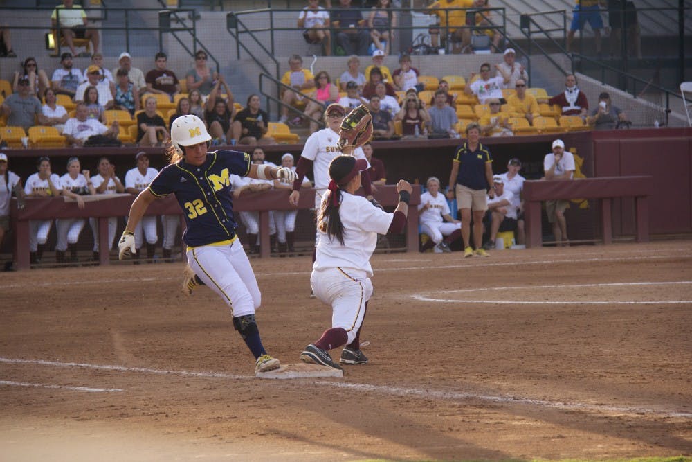 Junior first baseman Bethany Kemp tags a Michigan Wolverine, the second out of the play for the Devils during game two of the NCAA Tempe Regional Championships against the Michigan Wolverines on Sunday, May 18, at Farrington Stadium. ASU lost to Michigan 4-5. (Photo by Becca Smouse)