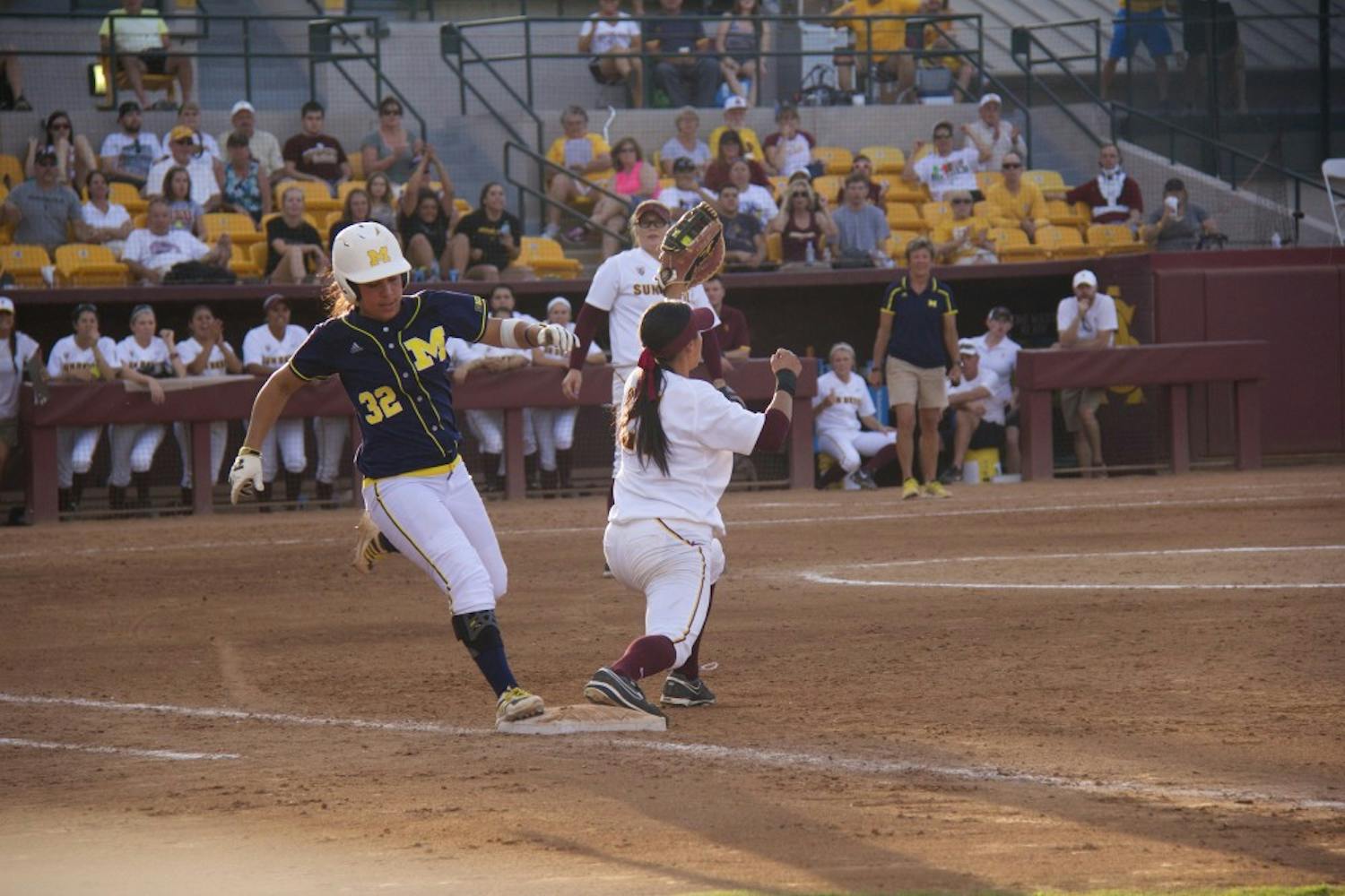 Junior first baseman Bethany Kemp tags a Michigan Wolverine, the second out of the play for the Devils during game two of the NCAA Tempe Regional Championships against the Michigan Wolverines on Sunday, May 18, at Farrington Stadium. ASU lost to Michigan 4-5. (Photo by Becca Smouse)