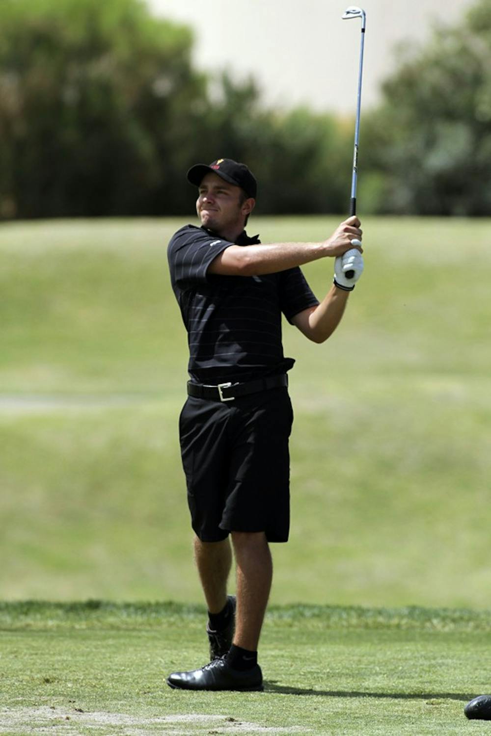 Rough Finish: ASU senior James Byrne watches his drive on Saturday at the ASU Thunderbird Invitational in Tempe. Byrne competed as an individual and placed 9th overall, the highest of all the Sun Devils at the invite. (Photo by Lisa Bartoli)