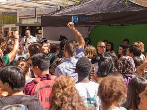 The crowd quickly formed around the photo booth preventing students who  had caught a koozie from getting their picture taken with co-stars Adam  DeVine and Anna Kendrick outside of the Campus Bookstore.