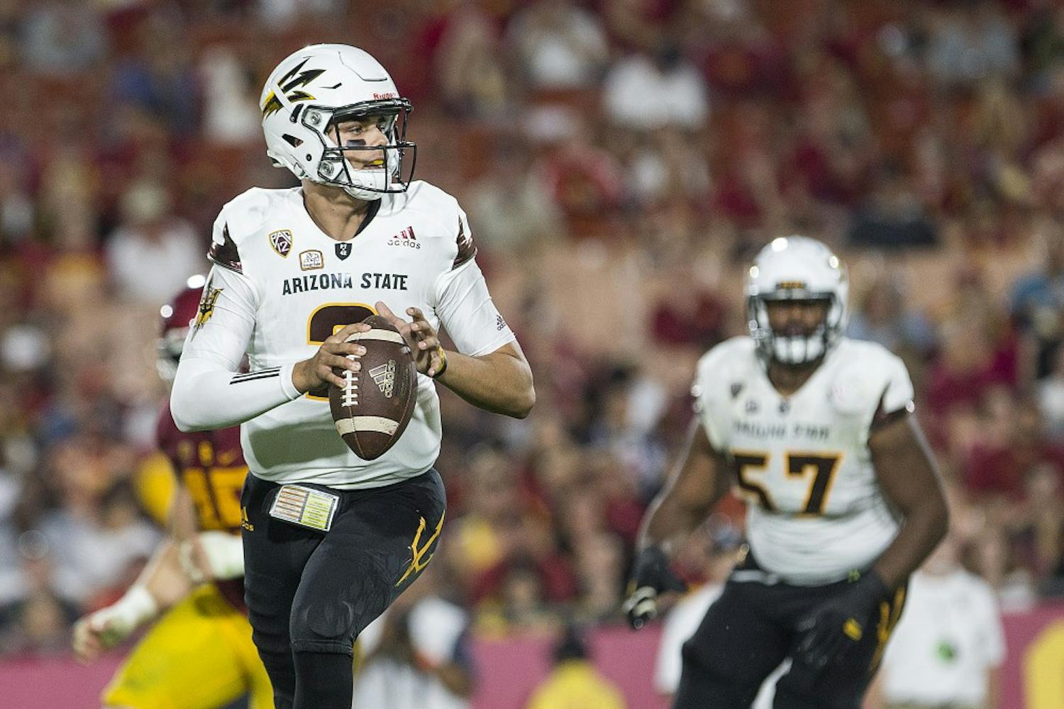 ASU Sun Devils quarterback Brady White (2) looks for an open receiver during a game against the USC Trojans in the Los Angeles Memorial Coliseum on Saturday, Oct. 1, 2016.  The Sun Devils lost the contest, 41-20.