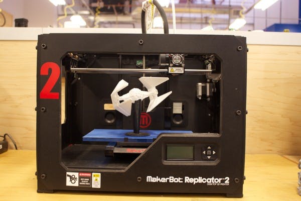 A MakerBot 3-D printer with a TIE Interceptor™ from Star Wars inside. TechShop members have access to MakerBot 3-D printers that can print anything from pinecones to the TIE Interceptor™ from Star Wars. (Photo by Andrew Nicla)