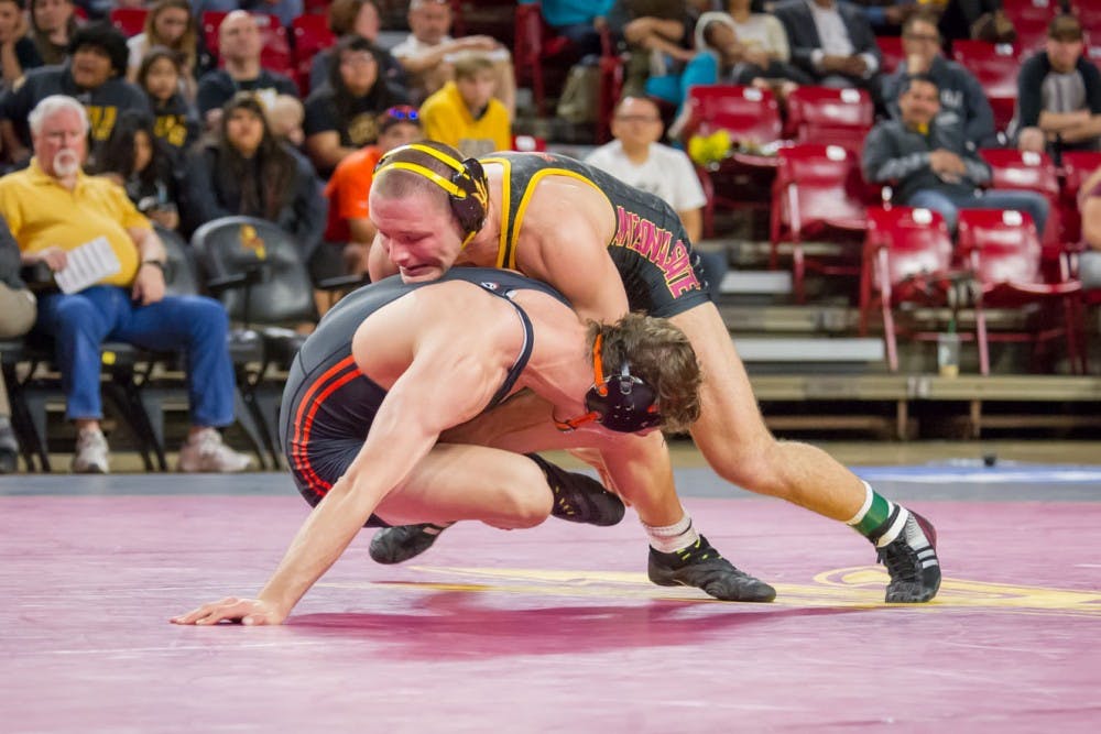 Redshirt senior Blake Stauffer takes down Oregon State's Corey Griego for two points on Friday, Jan. 29, 2016, at the Wells Fargo Arena in Tempe.