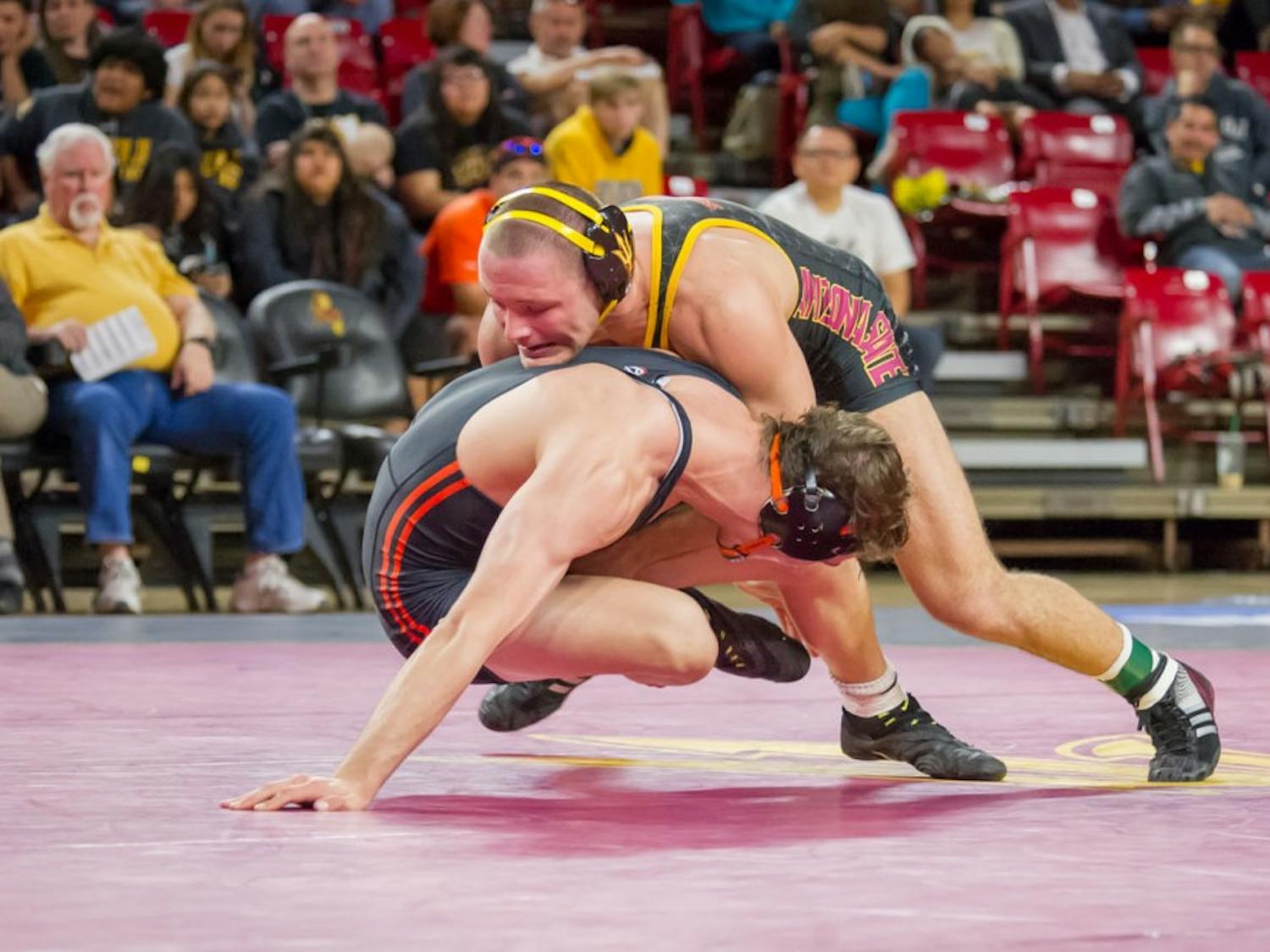 Redshirt senior Blake Stauffer takes down Oregon State's Corey Griego for two points on Friday, Jan. 29, 2016, at the Wells Fargo Arena in Tempe.