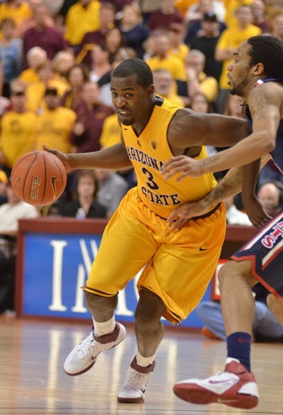 Remaining Upbeat: ASU senior guard Ty Abbott tries to drive inside during the Sun Devils’ 67-52 loss to UA on Sunday. Despite the team’s poor Pac-10 record, Abbott has had a strong year on the defensive side of the ball. (Photo by Aaron Lavinsky)