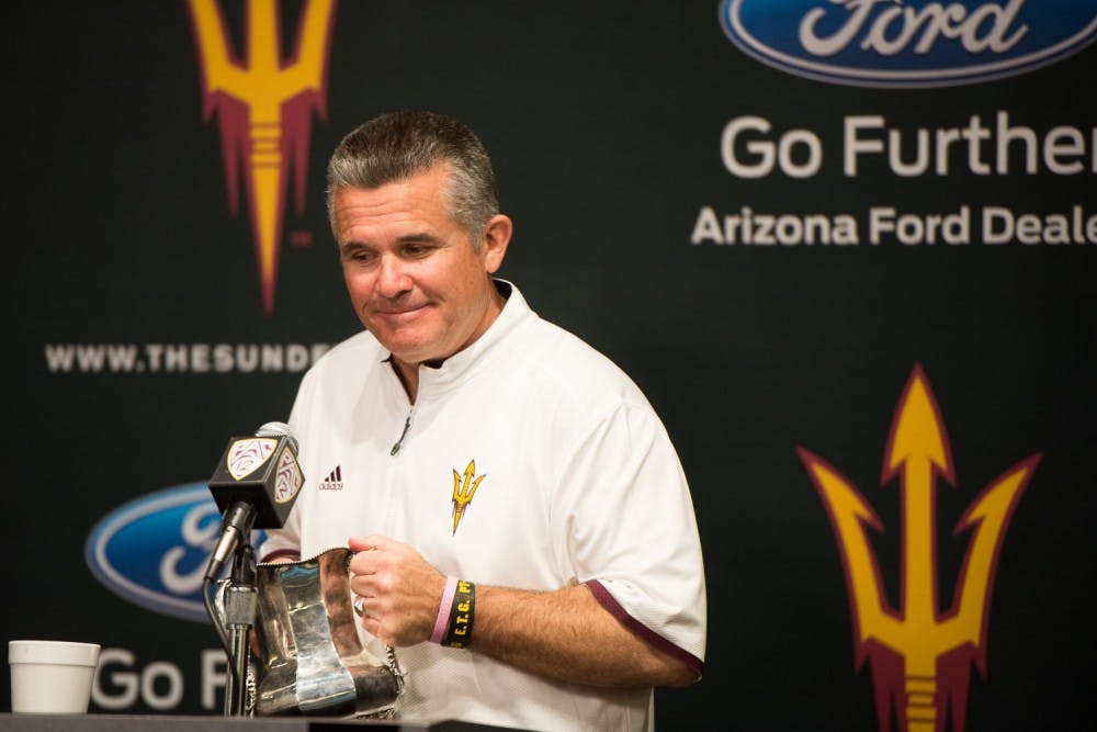 Head coach Todd Graham holds the Territorial Cup after defeating UA on Saturday, Nov. 21, 2015, at Sun Devil Stadium in Tempe.