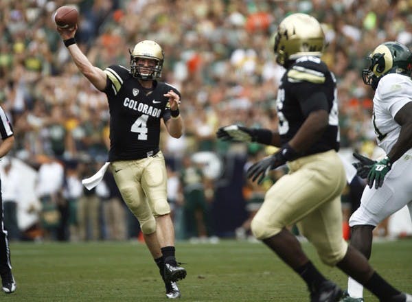 Quarterback Jordan Webb dumps the ball to fullback Christian Powell during the Rocky Mountain Showdown Saturday, Sept. 1, 2012. The Buffs lost to Colorado State 22-17. (CU Independent/James Bradbury)