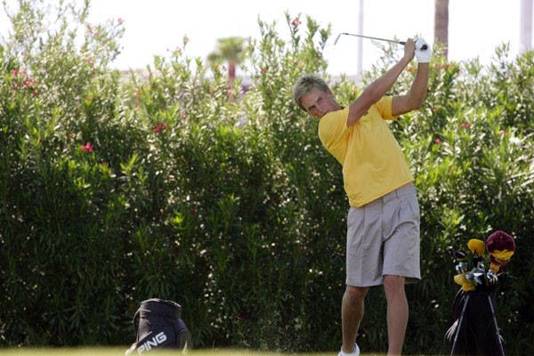 MATT PAVELEK/THE STATE PRESSSophomore Jesper Kennegard takes a few practice swings at Karsten Golf Course on Wednesday afternoon before the start of the season.