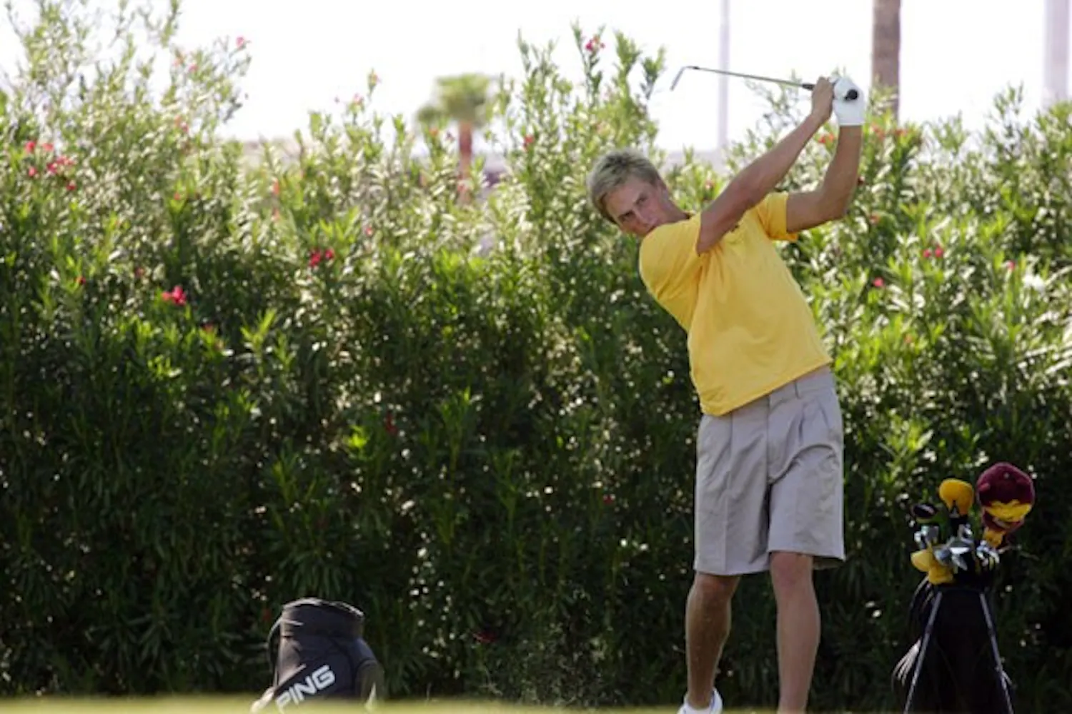 MATT PAVELEK/THE STATE PRESS
Sophomore Jesper Kennegard takes a few practice swings at Karsten Golf Course on Wednesday afternoon before the start of the season.