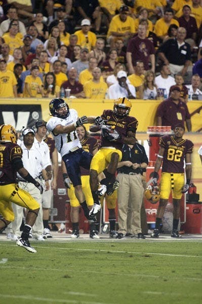 COOL AND COLLECTED: Junior wide receiver Mike Willie pulls in a pass during Saturday’s game against NAU. Willie caught eight passes for 114 yards and a touchdown. (Photo by Scott Stuk)